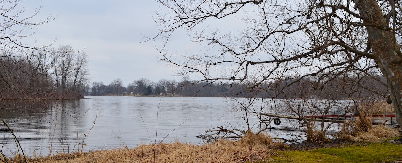 2 lakefront Investment homes with garages & 2 adjacent lots located on